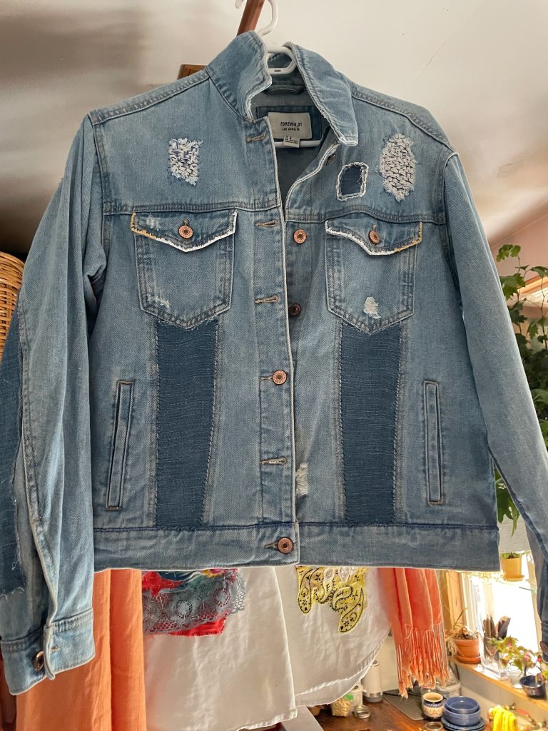 Up-cycled denim jacket with indigo sashiko patching on front.